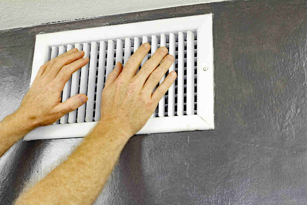 hands in front of an air vent