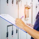 HVAC technician with checklist