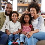 St Louis family together on couch