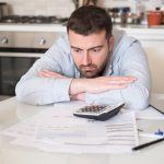 St. Louis man upset while doing bills