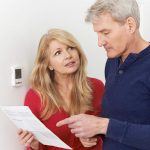 St. Louis couple discussing high HVAC bill