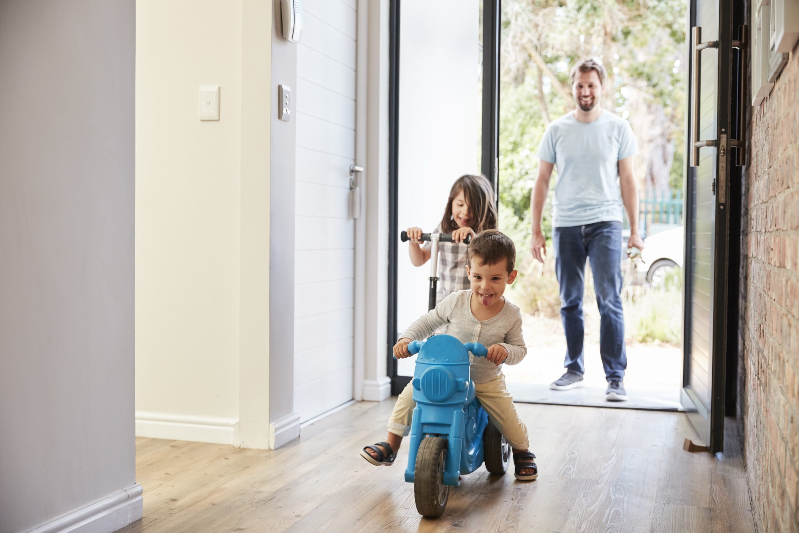 Family Entering Home after Service for Indoor Air Quality in St. Louis, MO