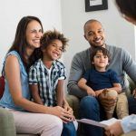 happy St. Louis family discussing HVAC options