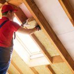 man installing insulation in a St. Louis home